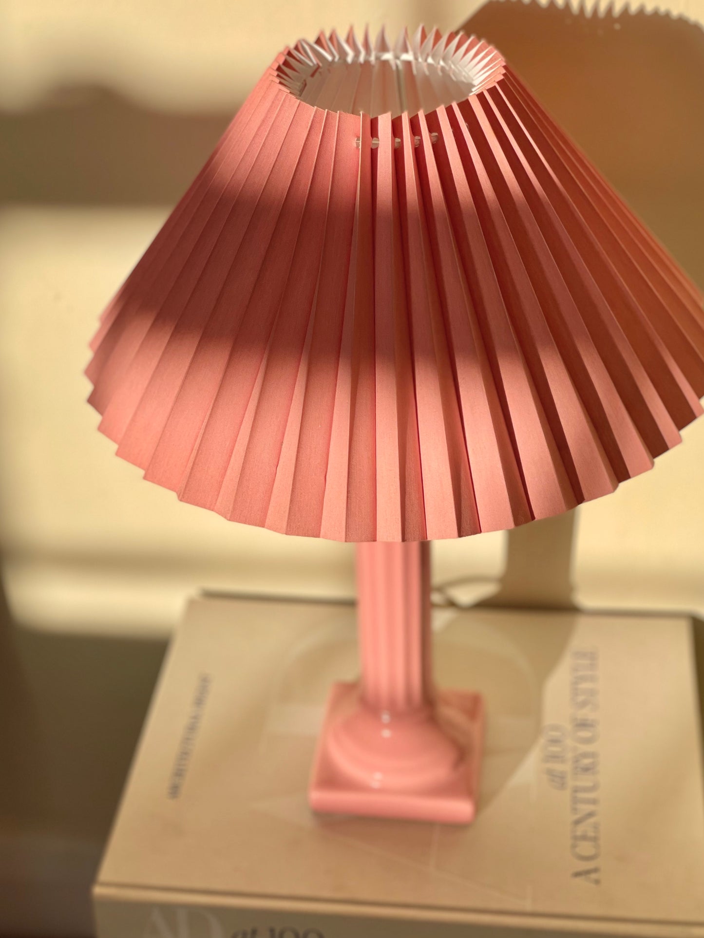 Pink corinthian column lamp with pleated shade