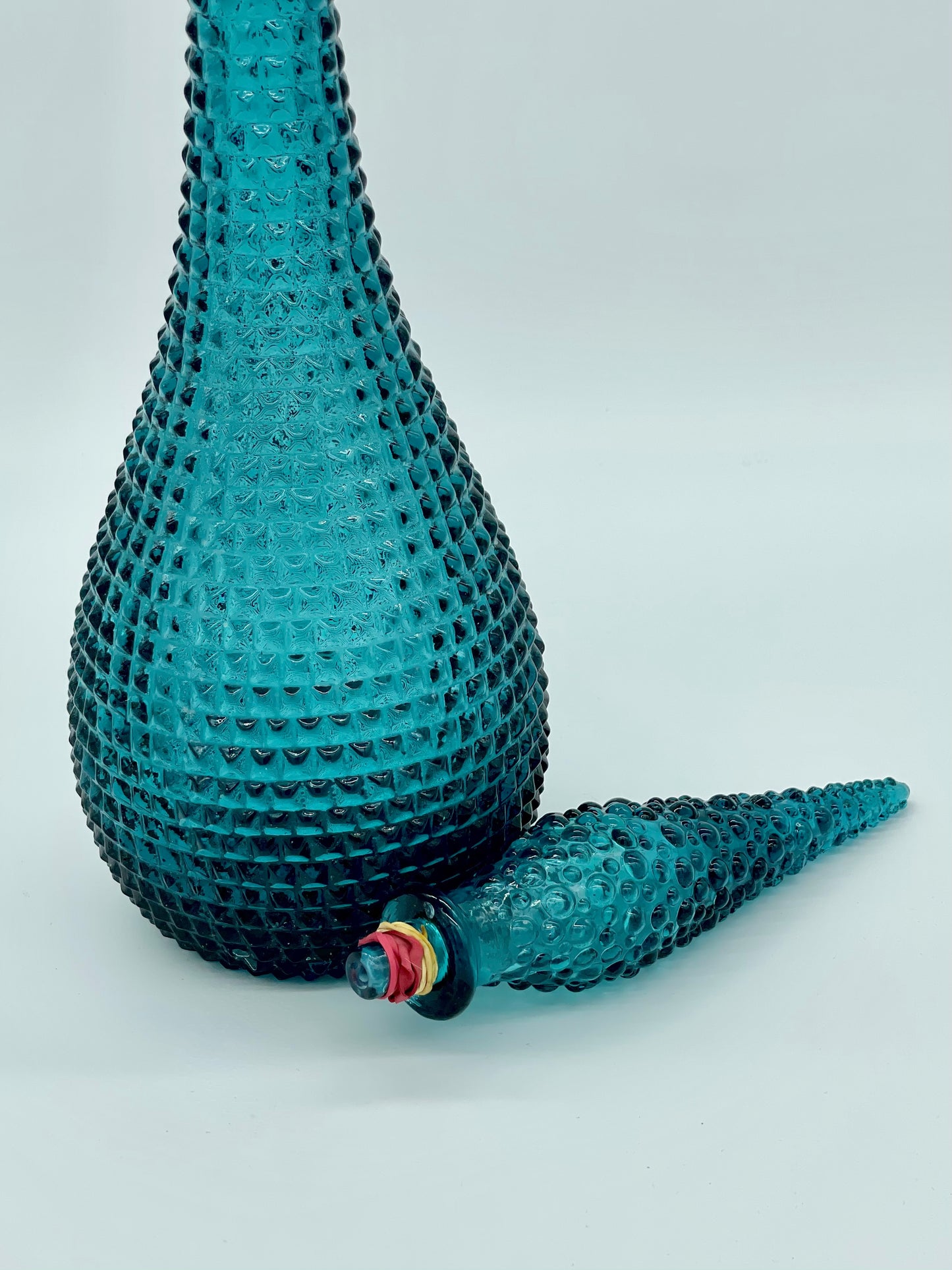 Teal coloured diamond hobnail genie bottle