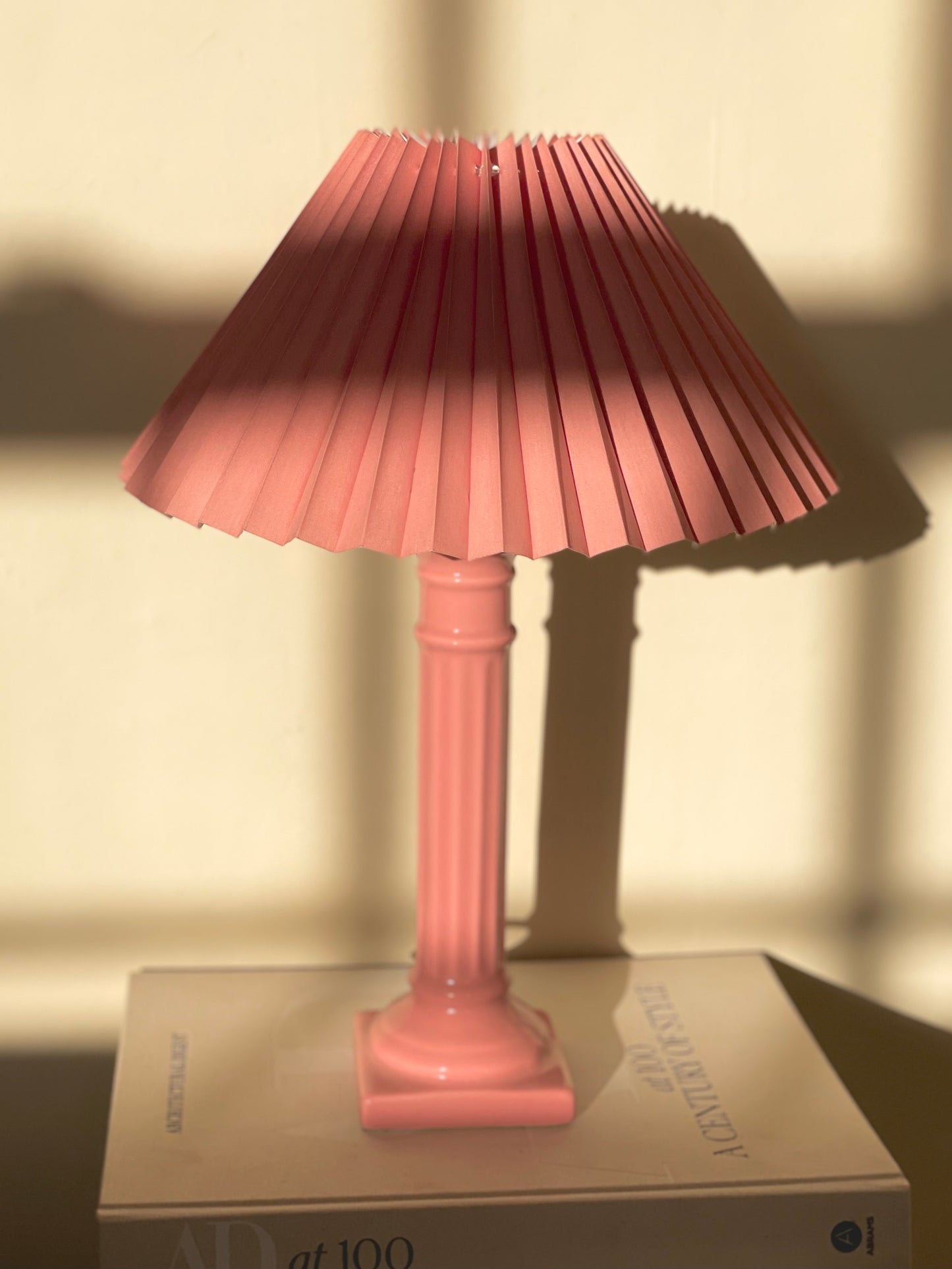 Pink corinthian column lamp with pleated shade