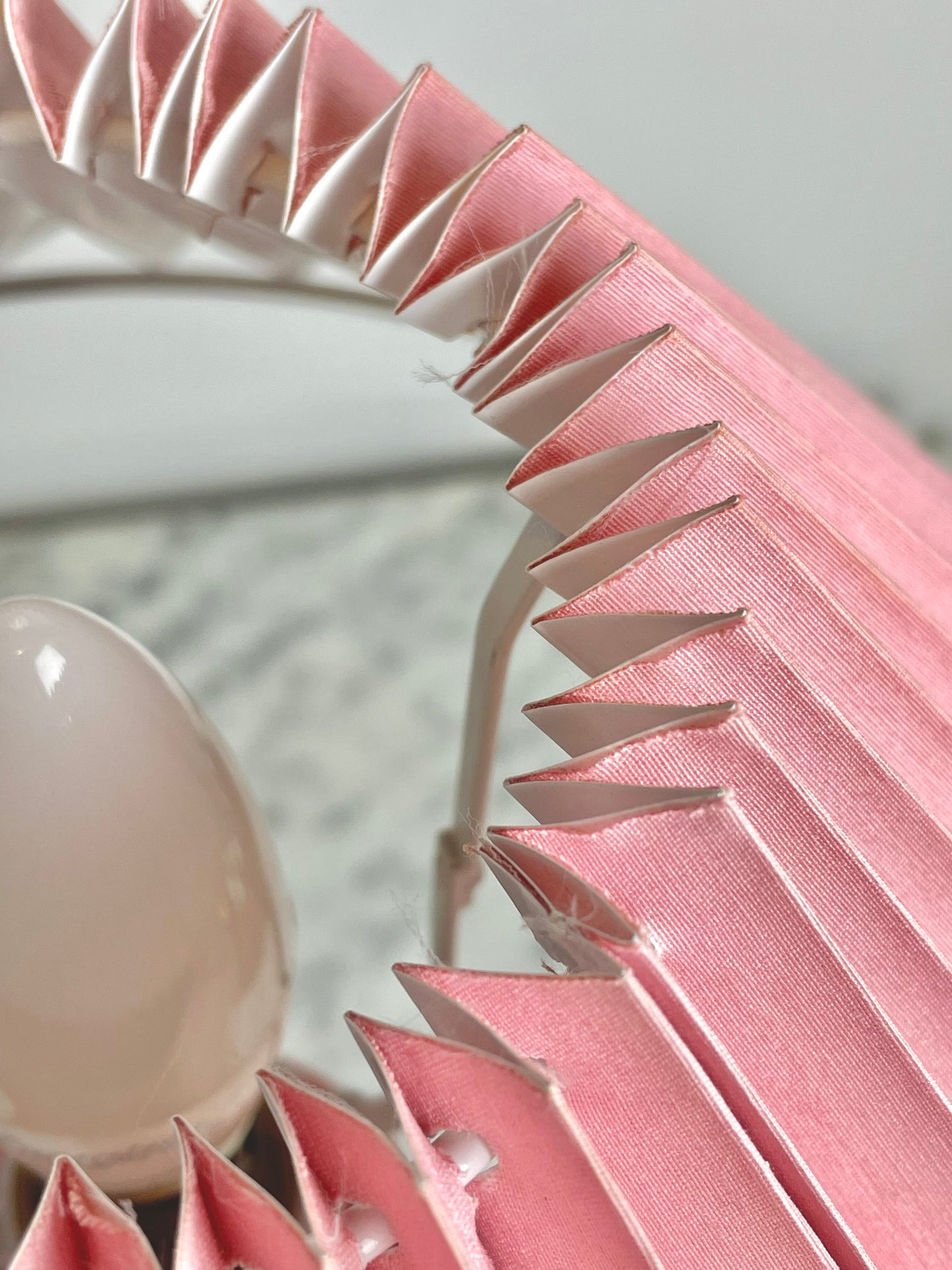 Pink corinthian column lamp with pleated shade