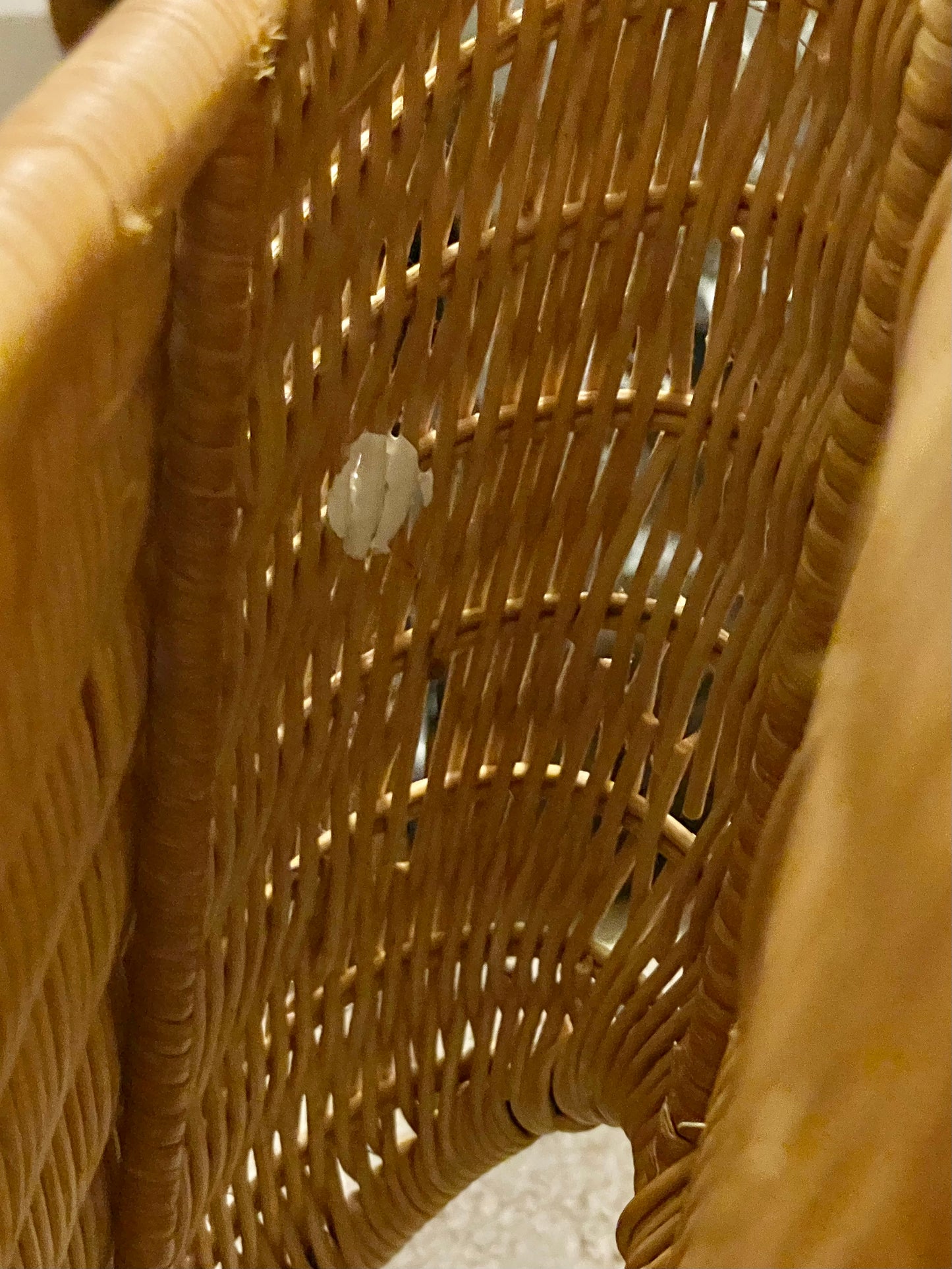 Wavy wall mounted wicker magazine rack circa 1970