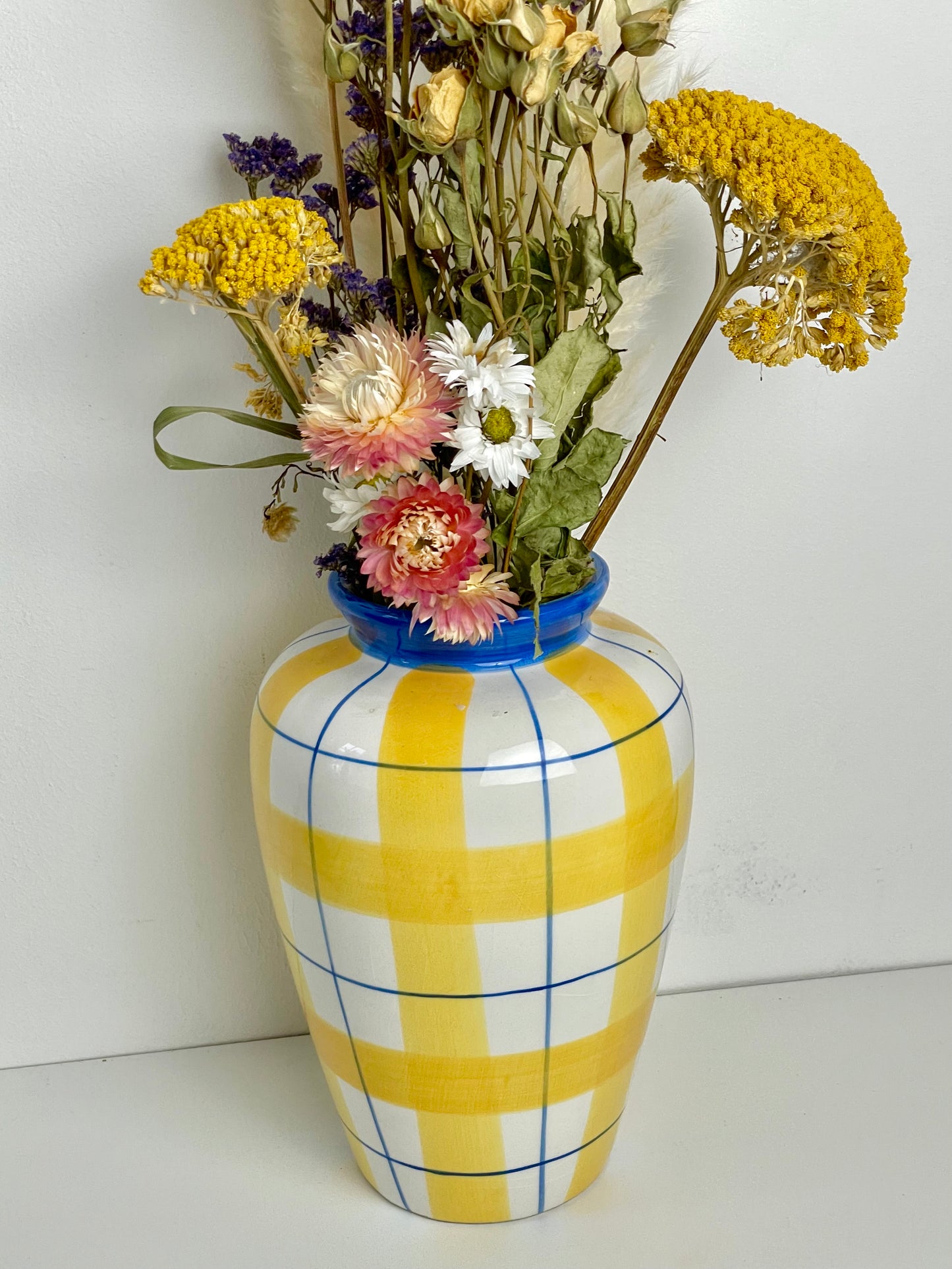 Yellow and blue ceramic checkered vase