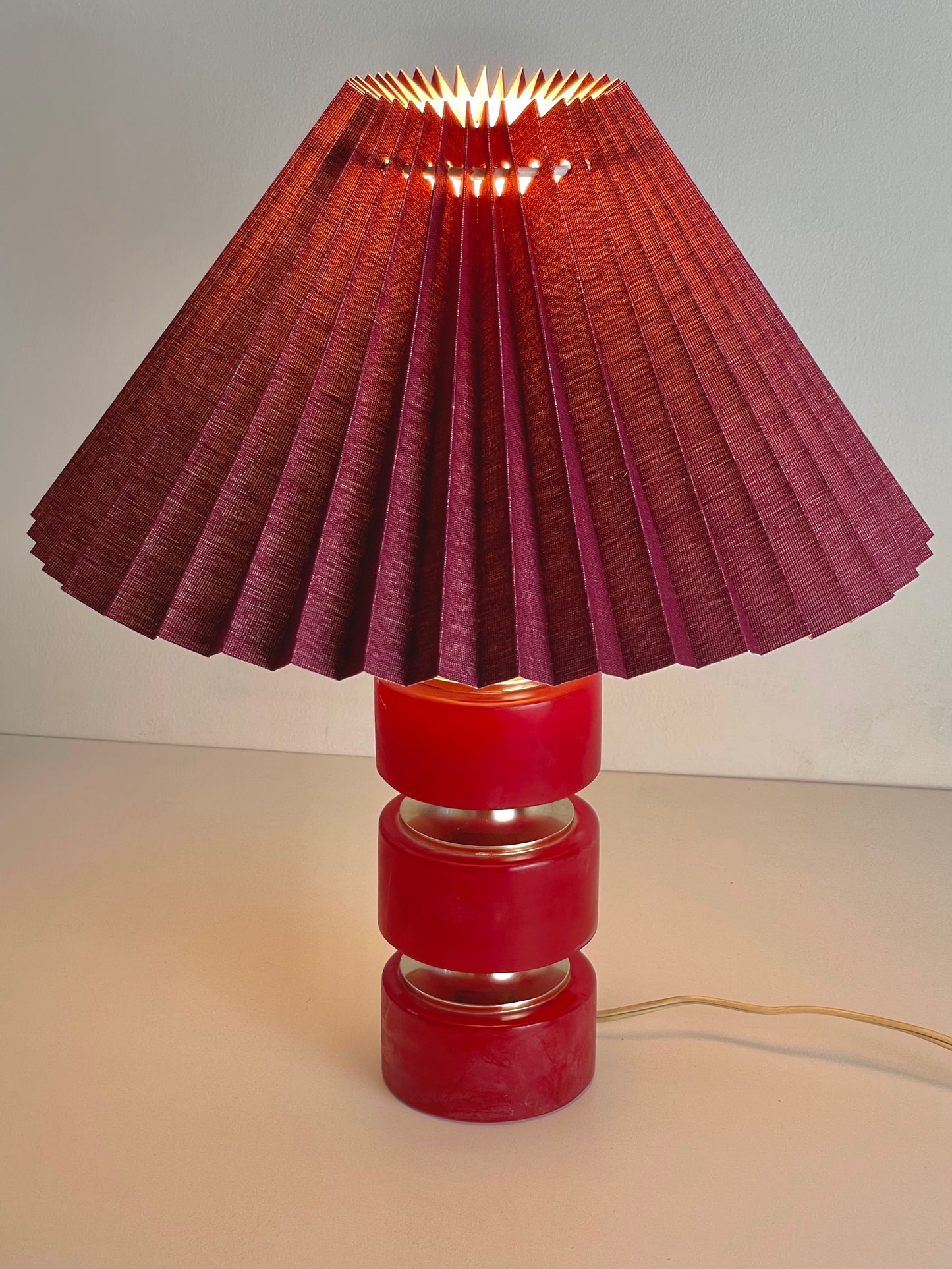 Pink stone hooped lamp with burgundy pleated shade