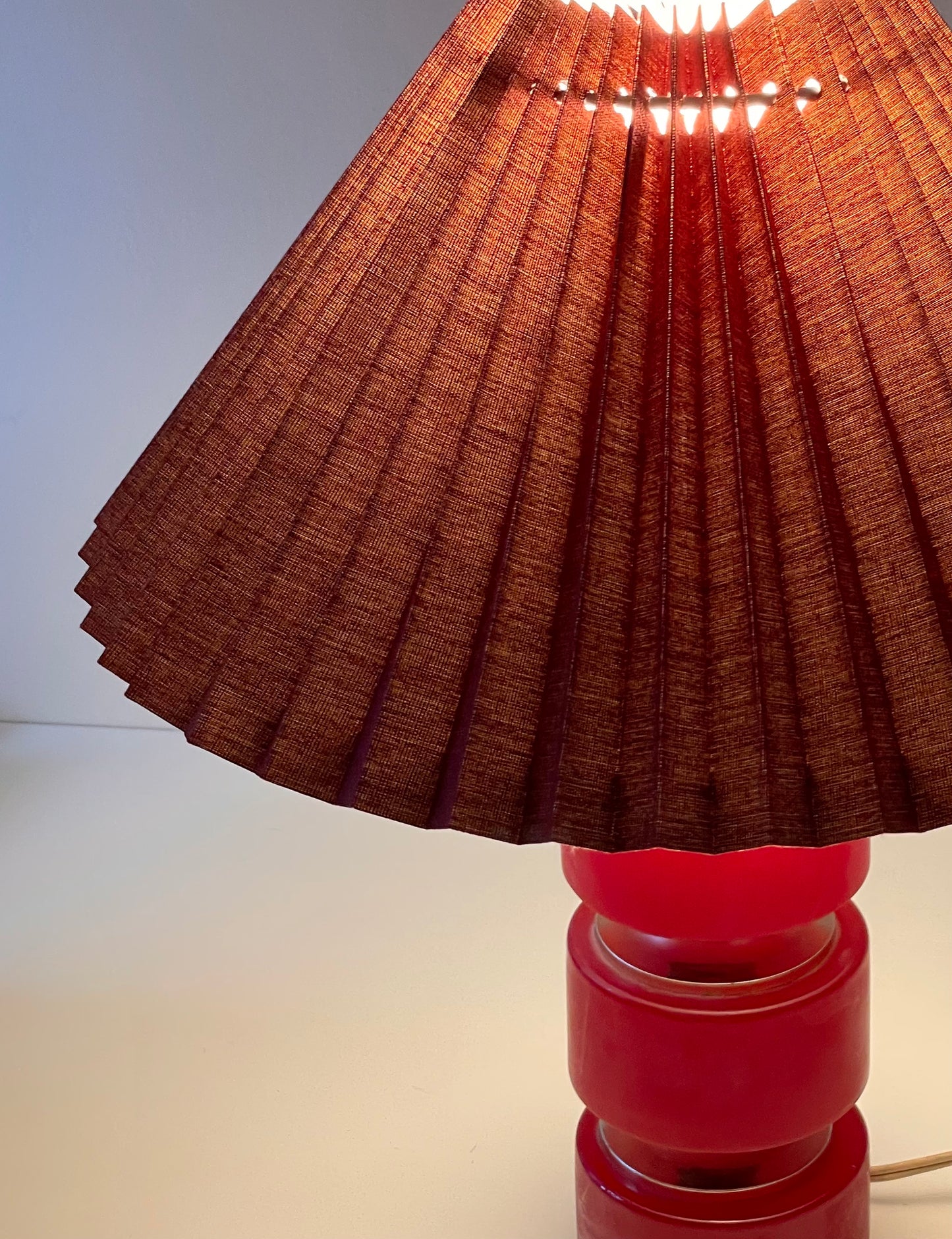 Pink stone hooped lamp with burgundy pleated shade