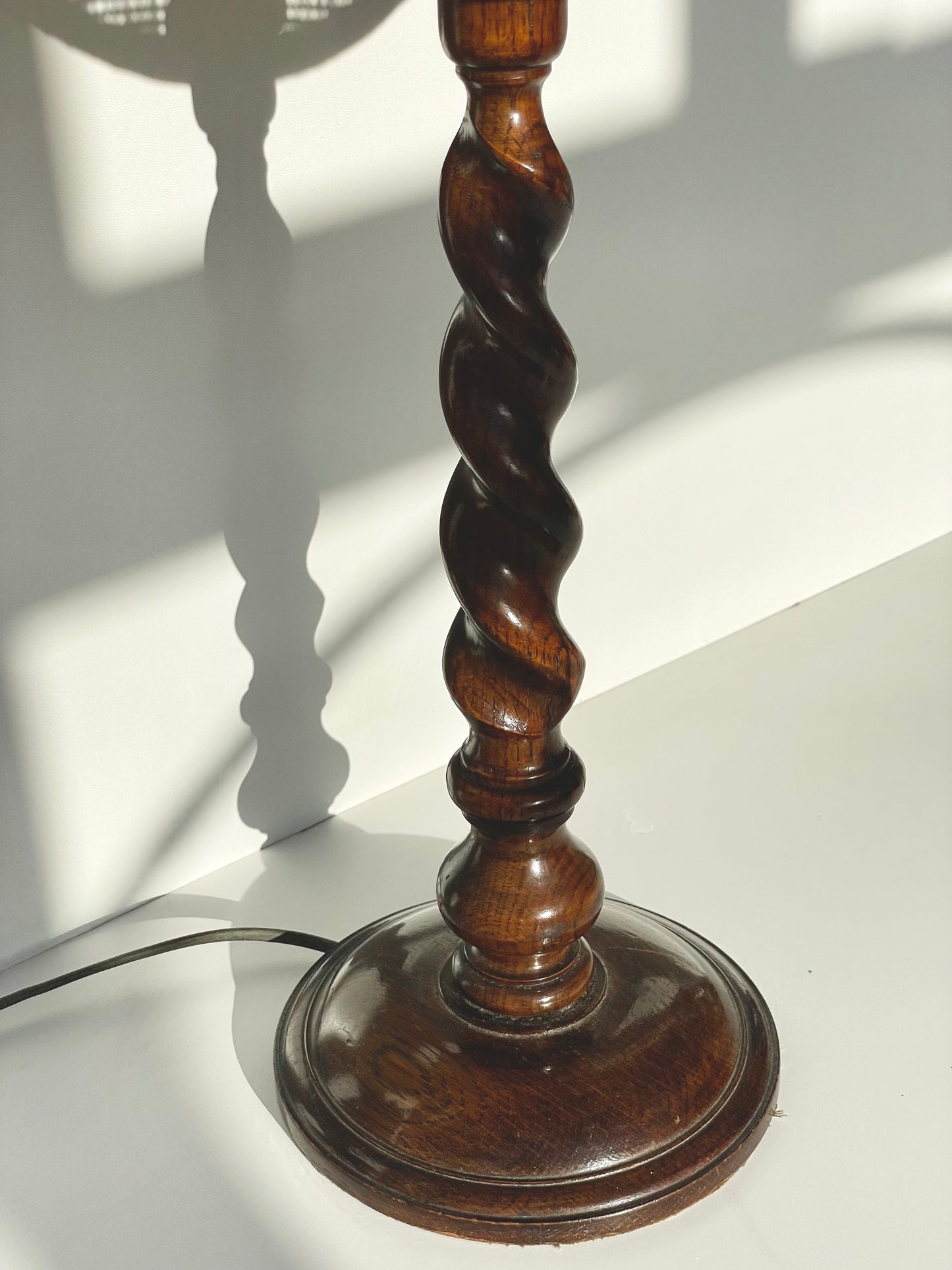 Dark oak barley sugar twist lamp with rattan shade