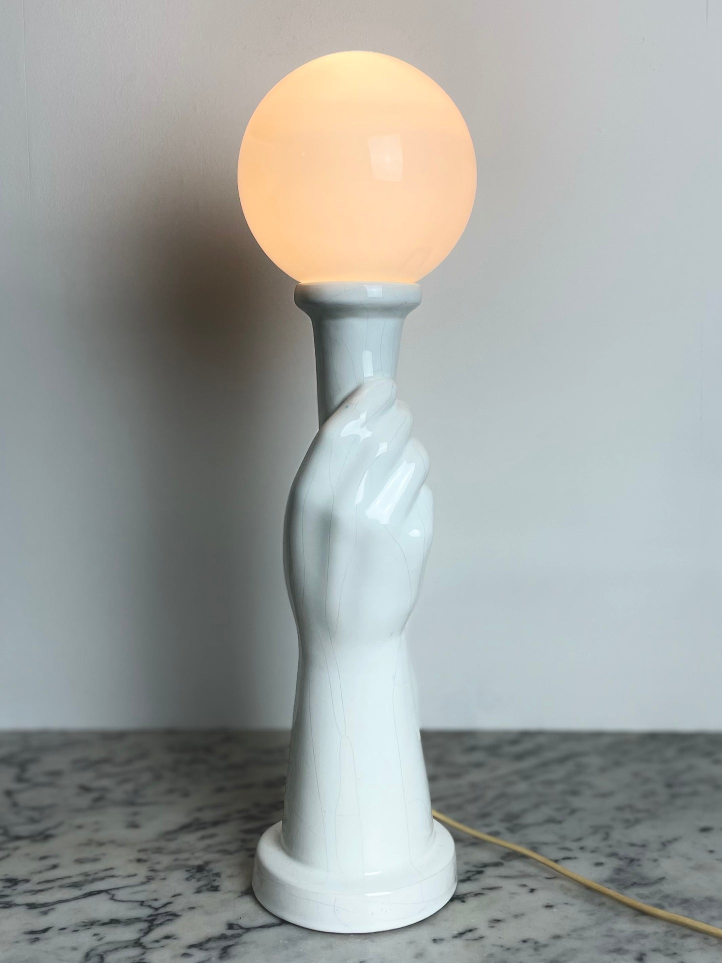 Art Deco style ceramic hand holding torch lamp
