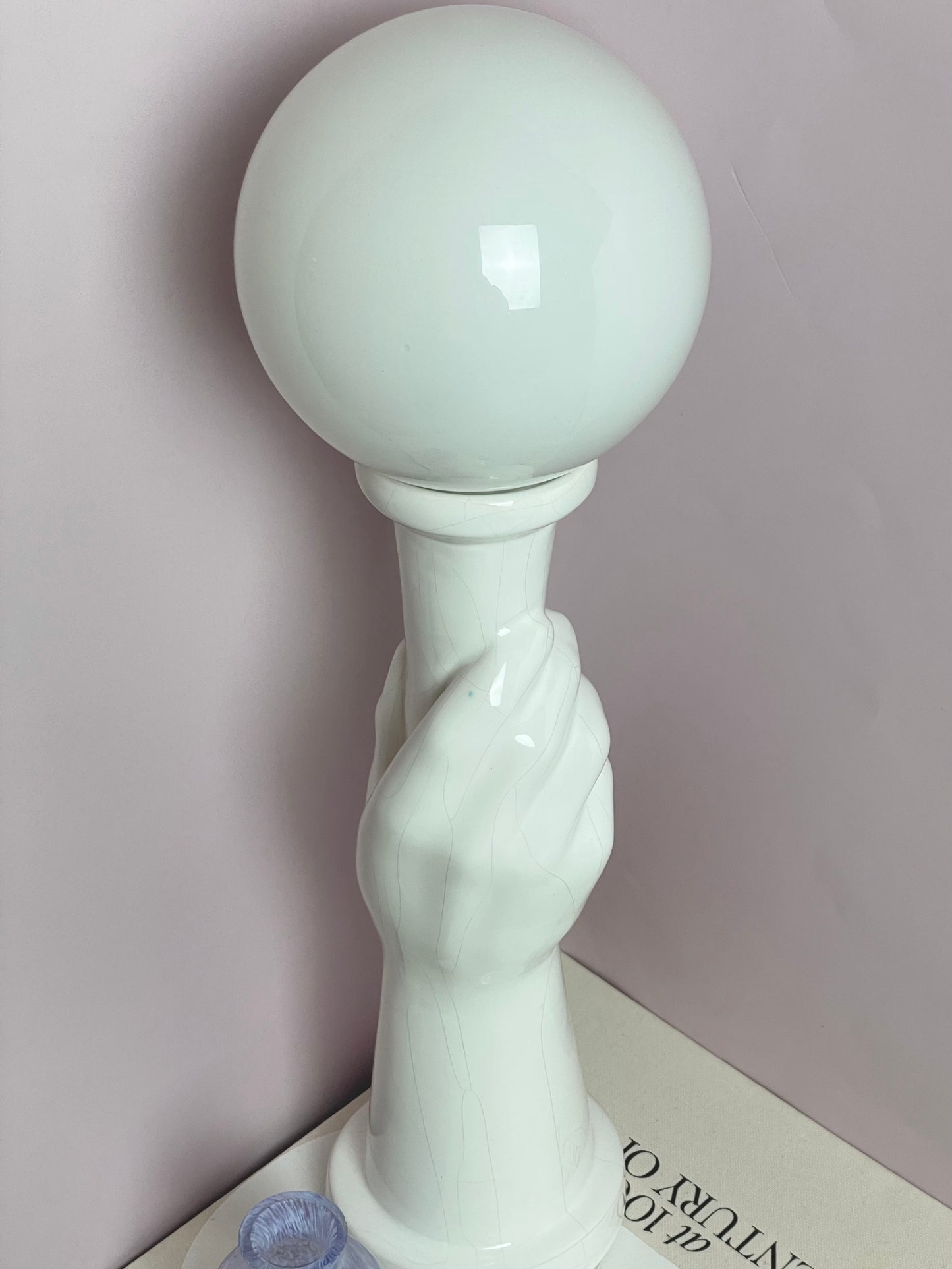 Art Deco style ceramic hand holding torch lamp