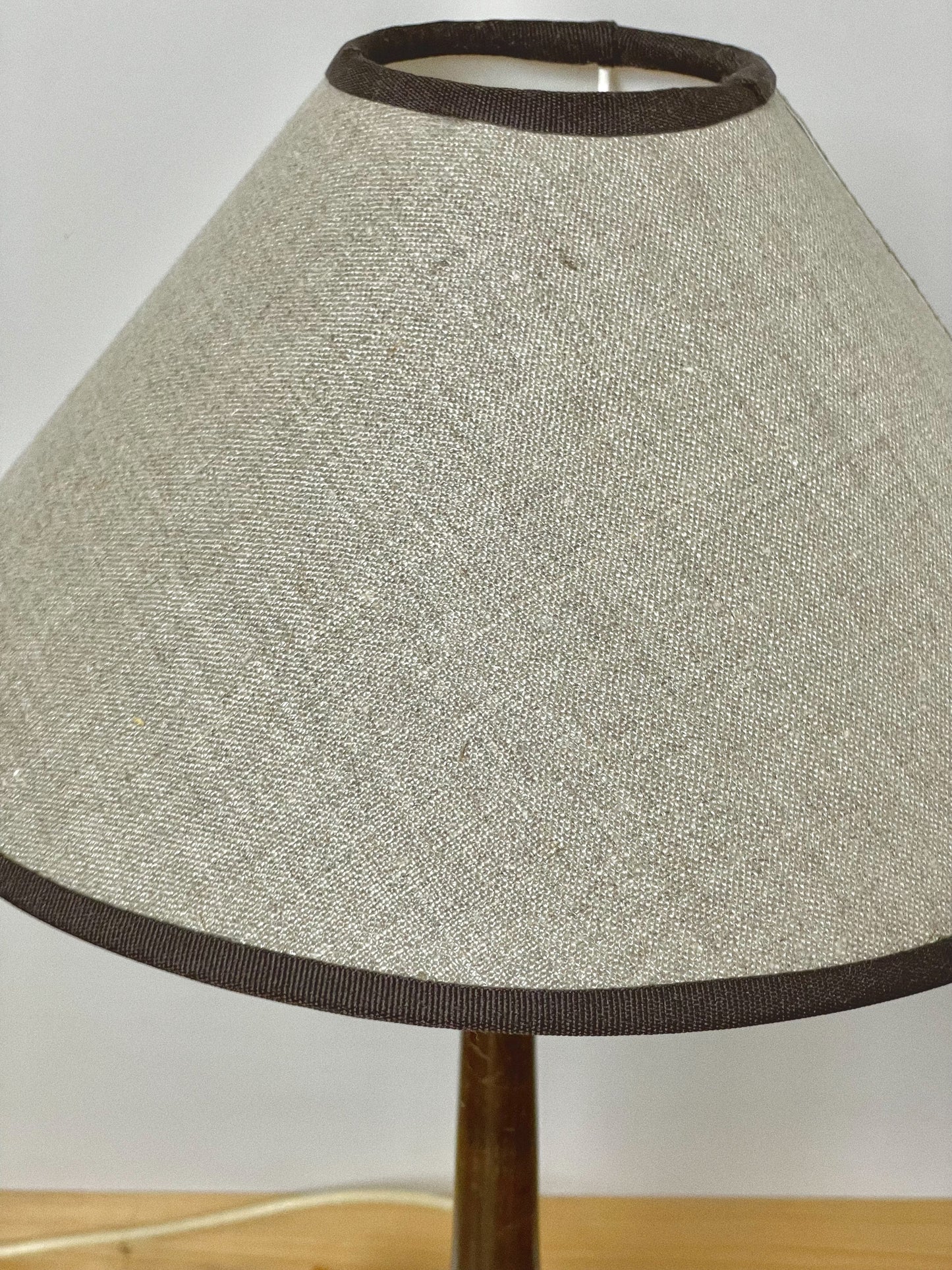Dark wood lamp with linen coolie shade