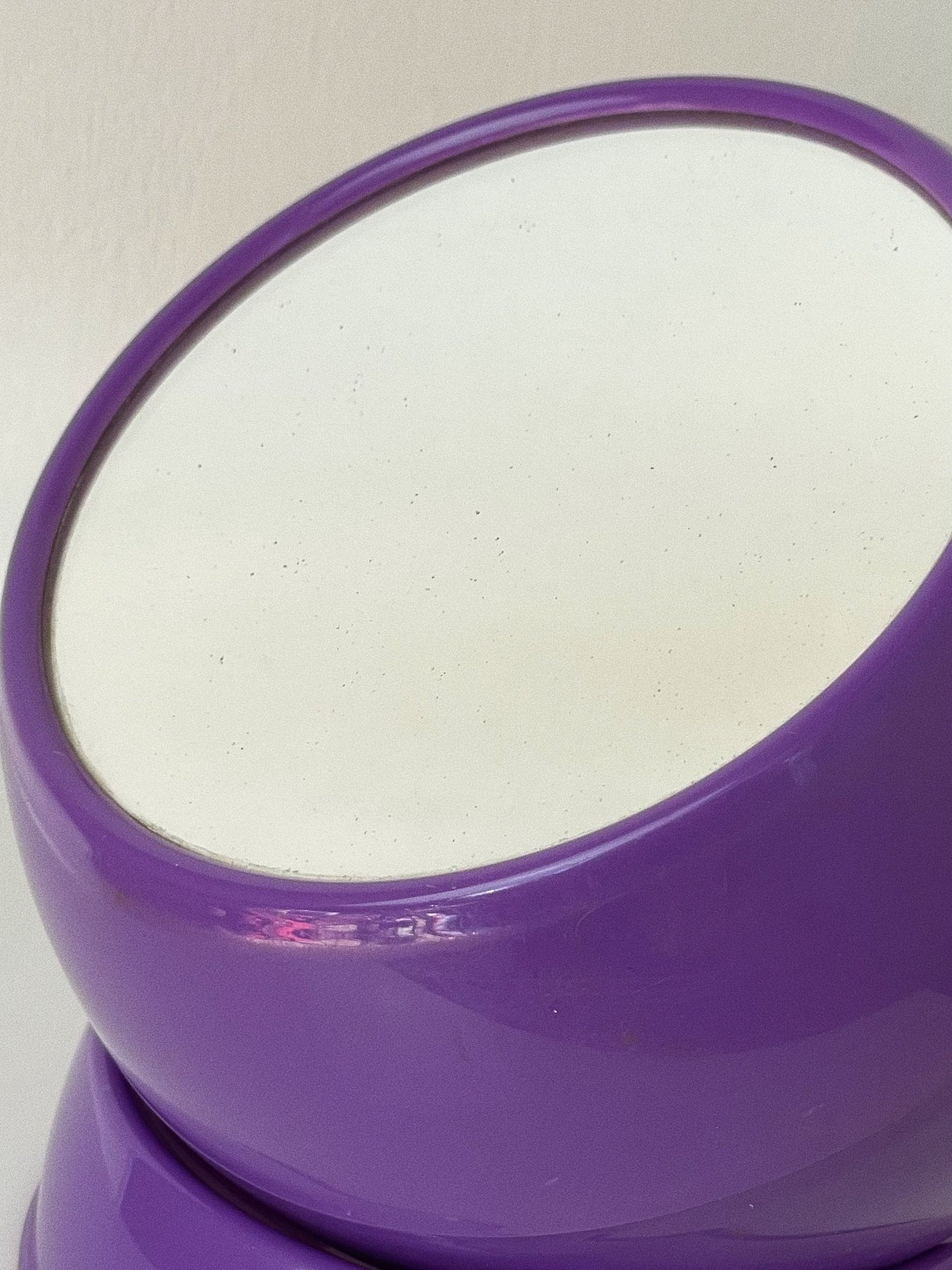 Space age style purple vanity mirror