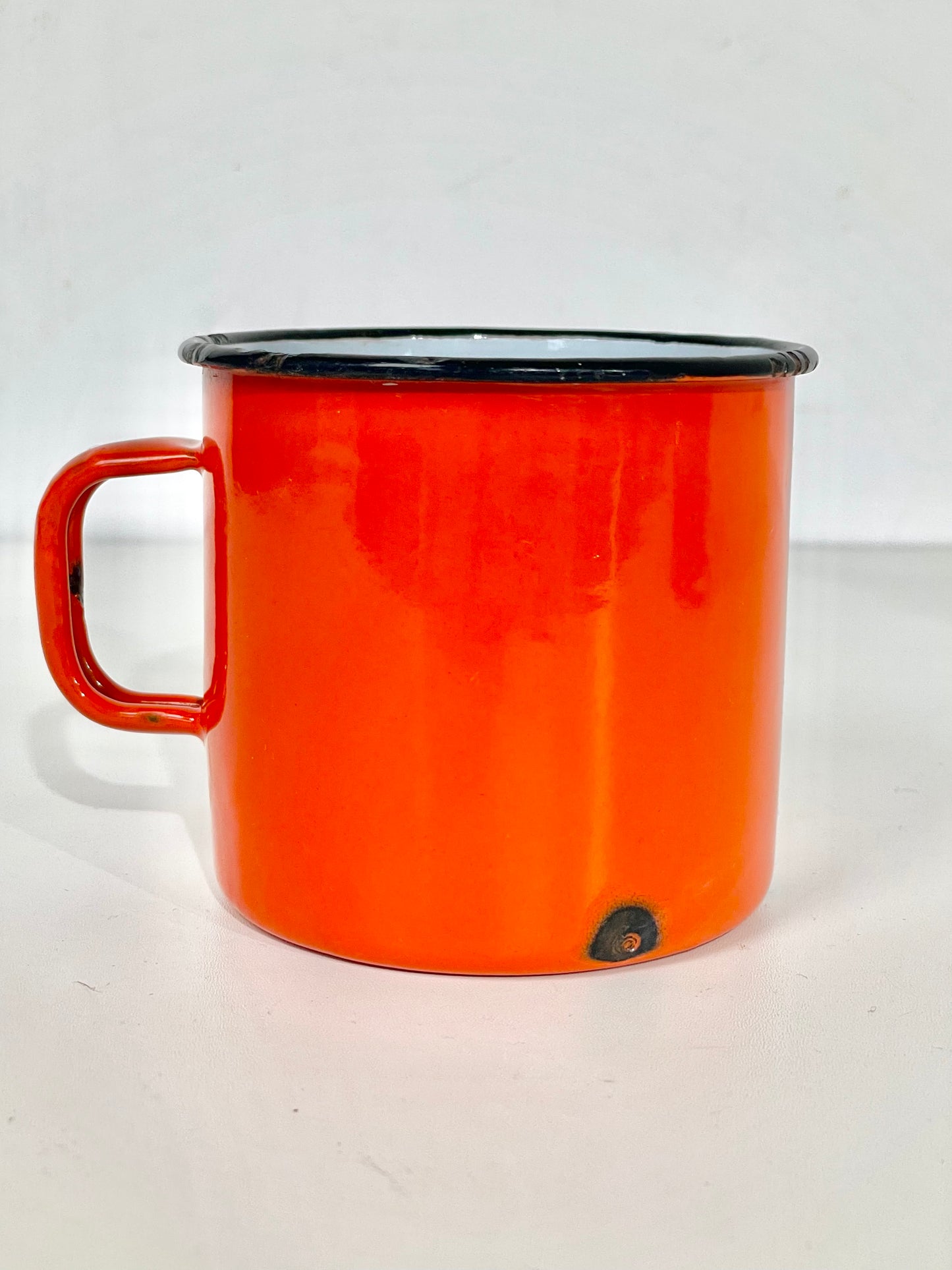 Deep orange enamel cup