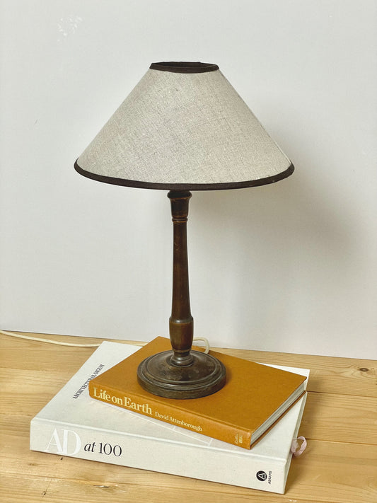 Dark wood lamp with linen coolie shade