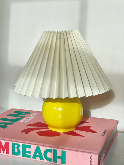 Yellow ball lamp with pleated shade