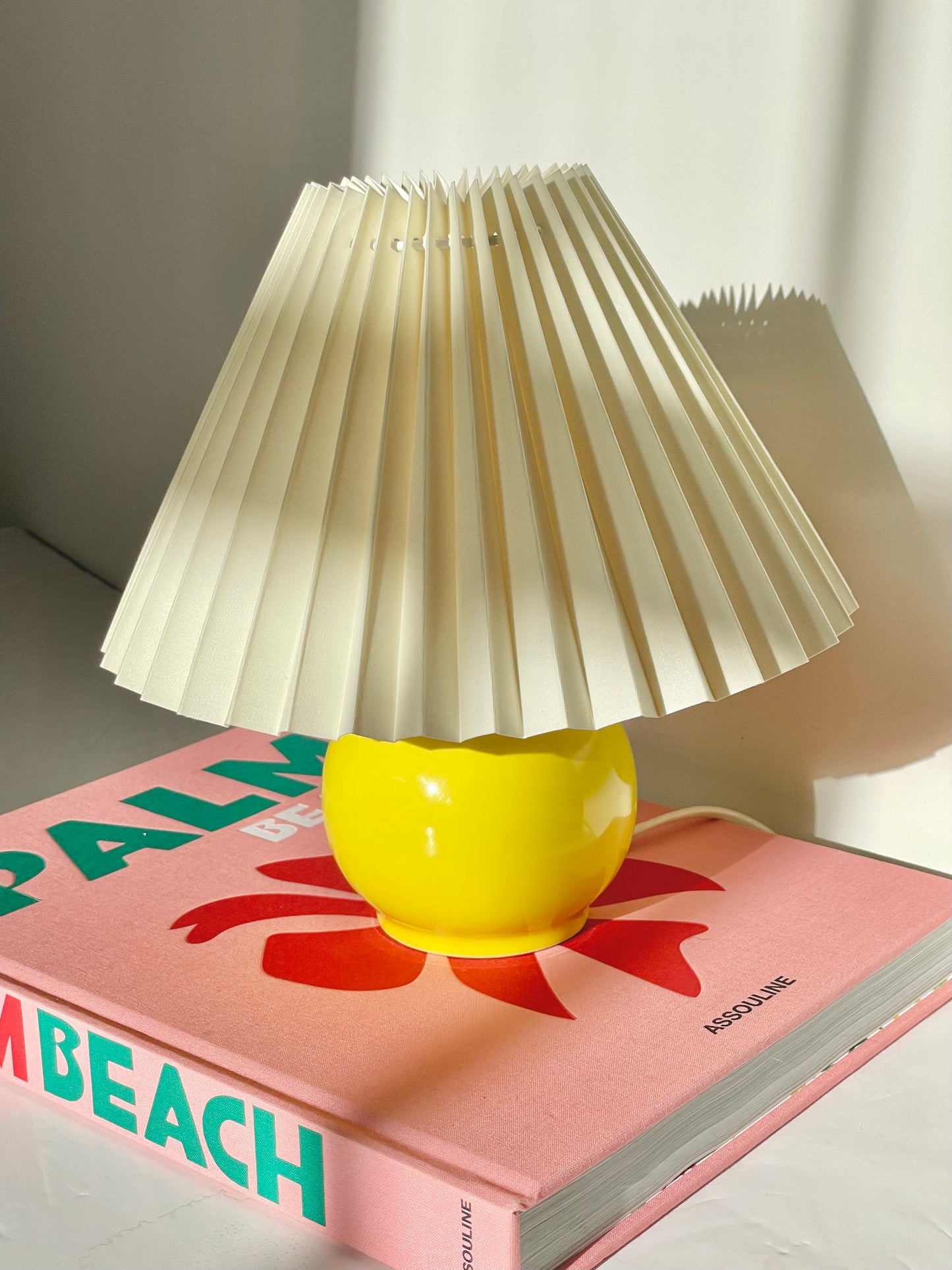 Yellow ball lamp with pleated shade