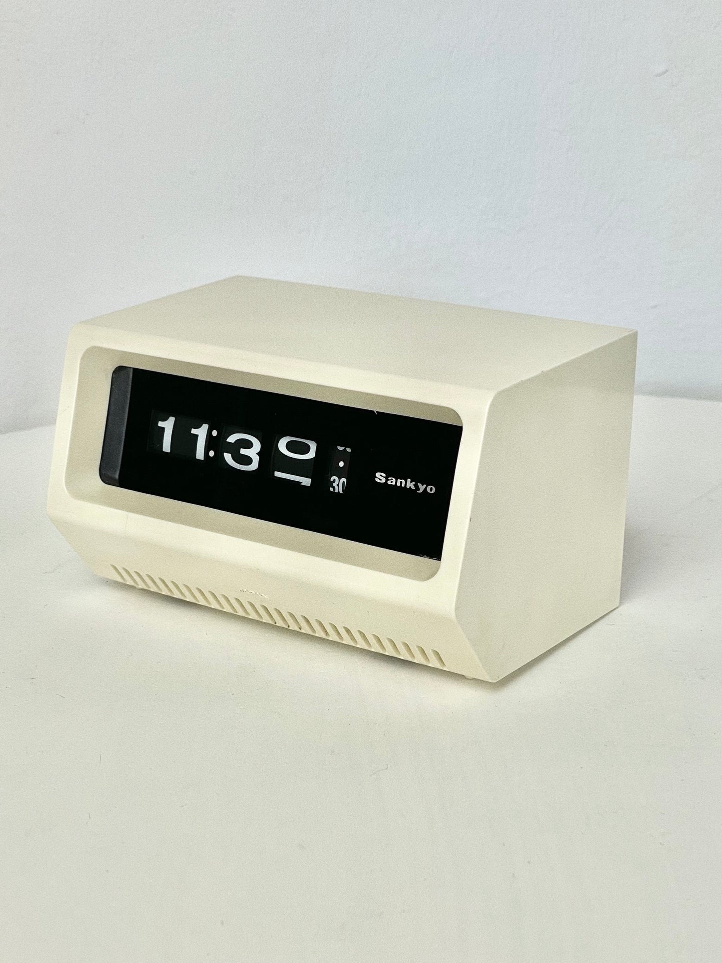 Sankyo roll clock in ivory