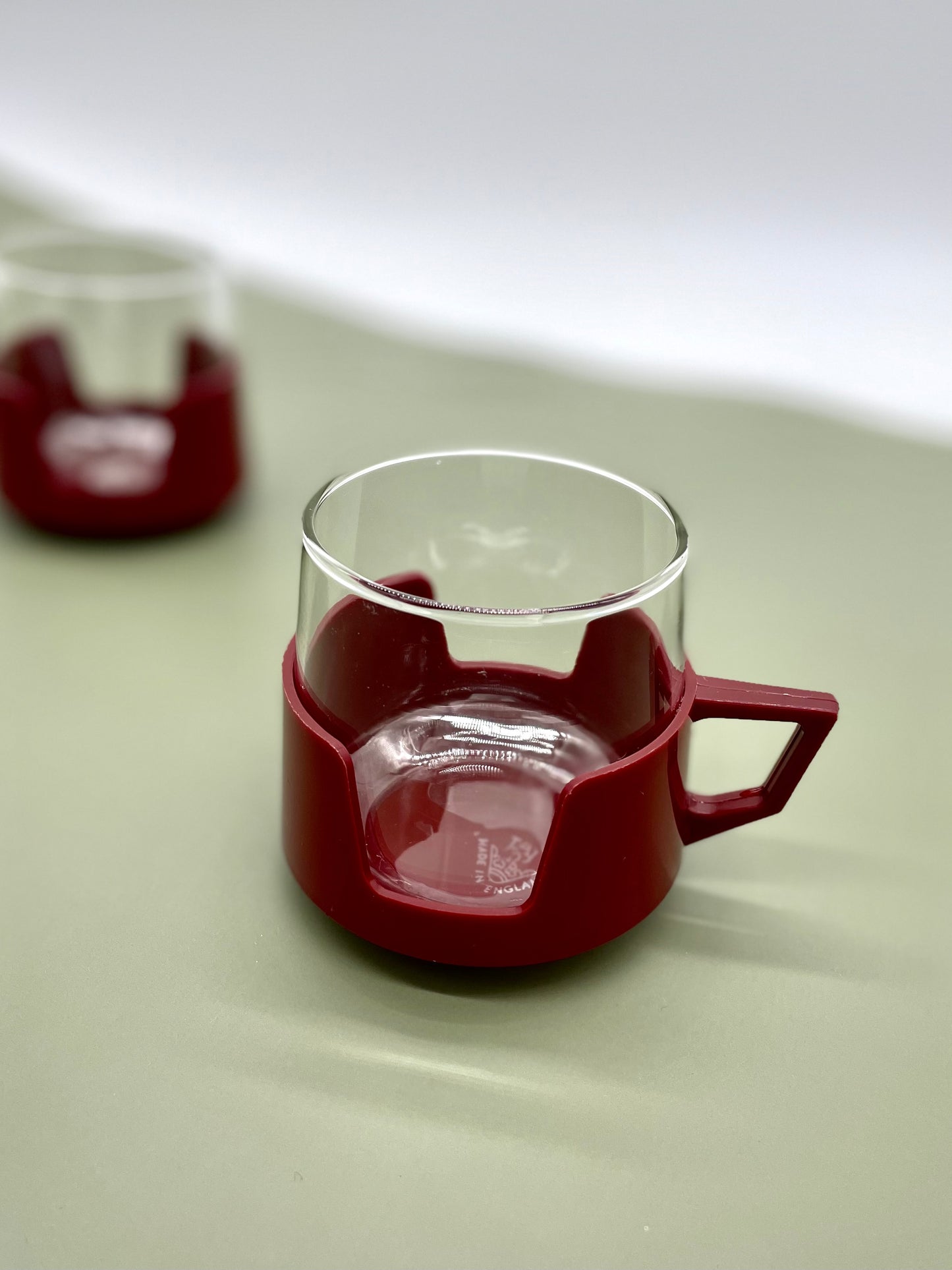 Pair of Retro JAJ glass cups with coloured holders