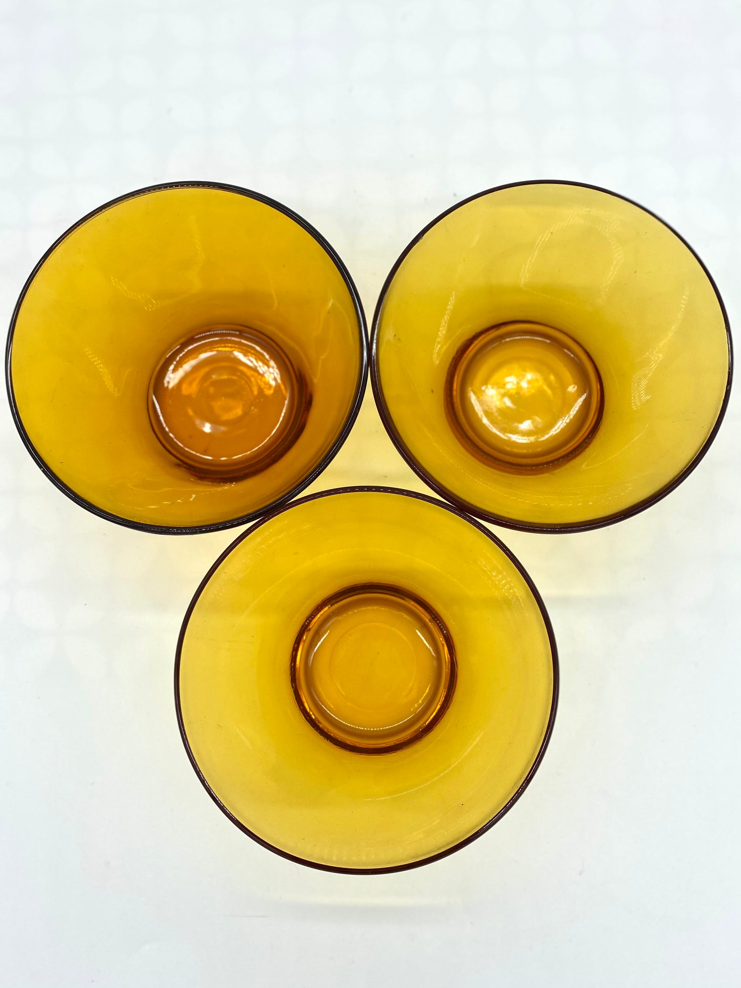 Trio of Verico glass amber bowls