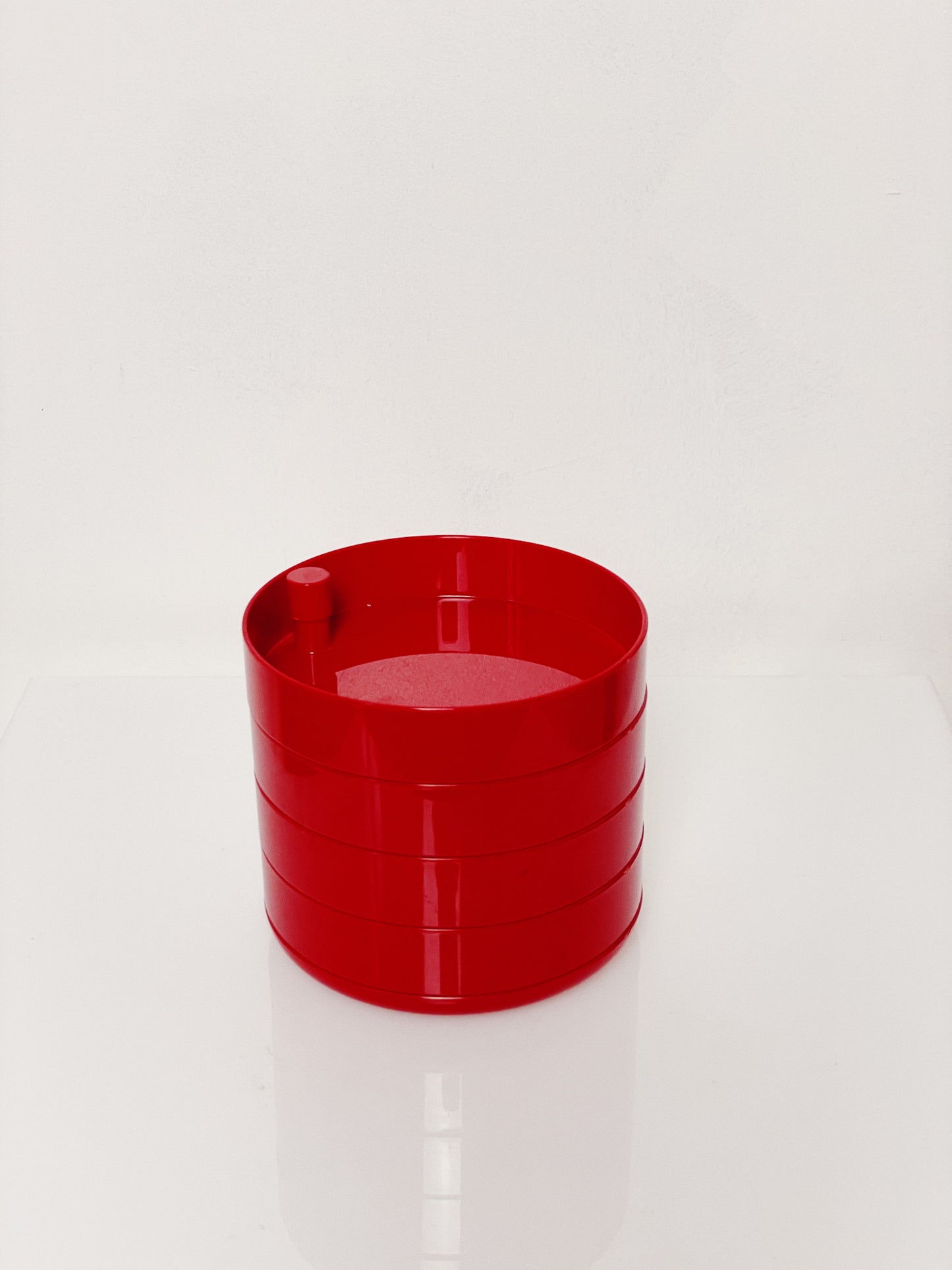 Red swivel desk tidy