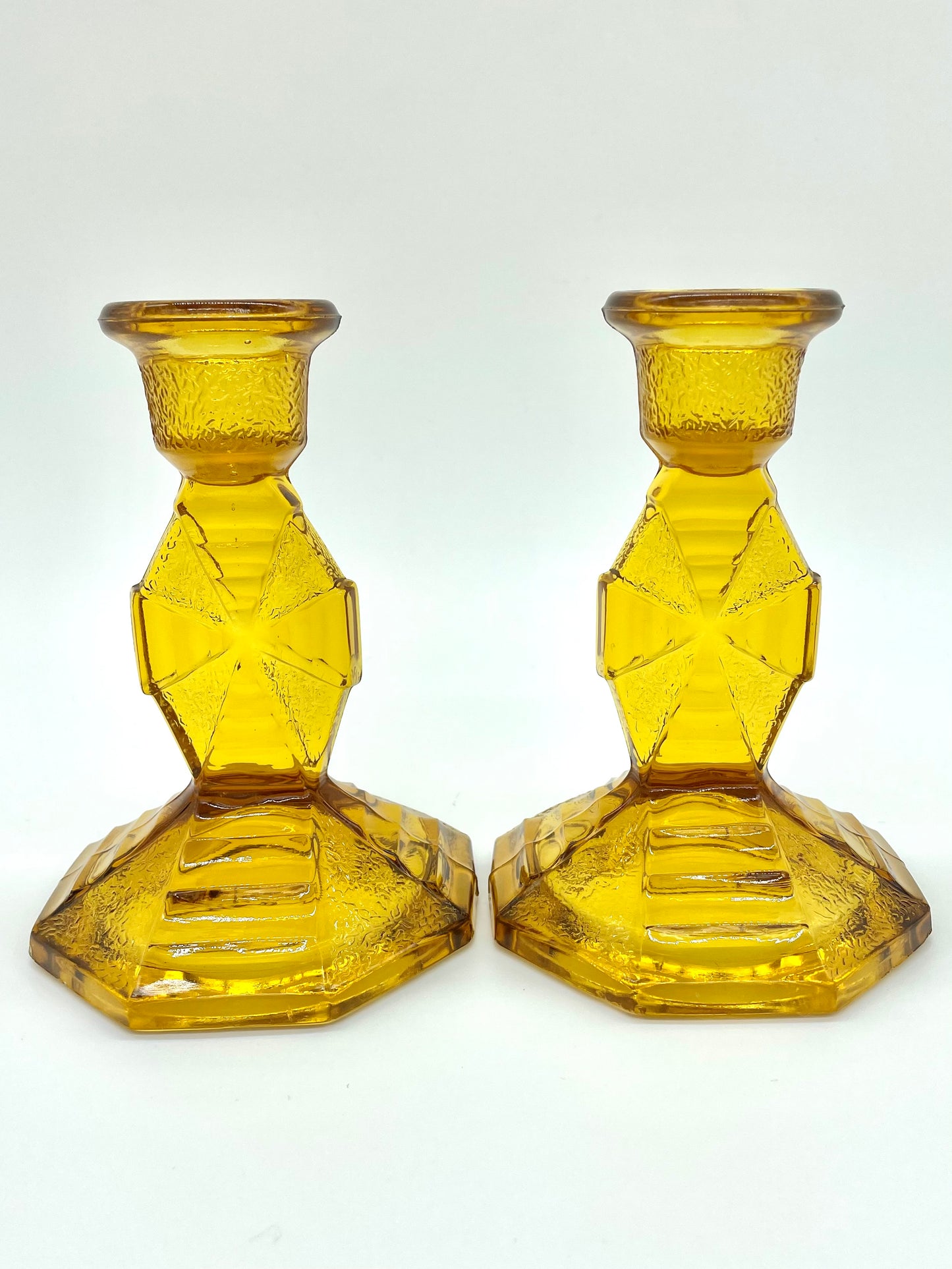 Pair of amber glass candlestick holders