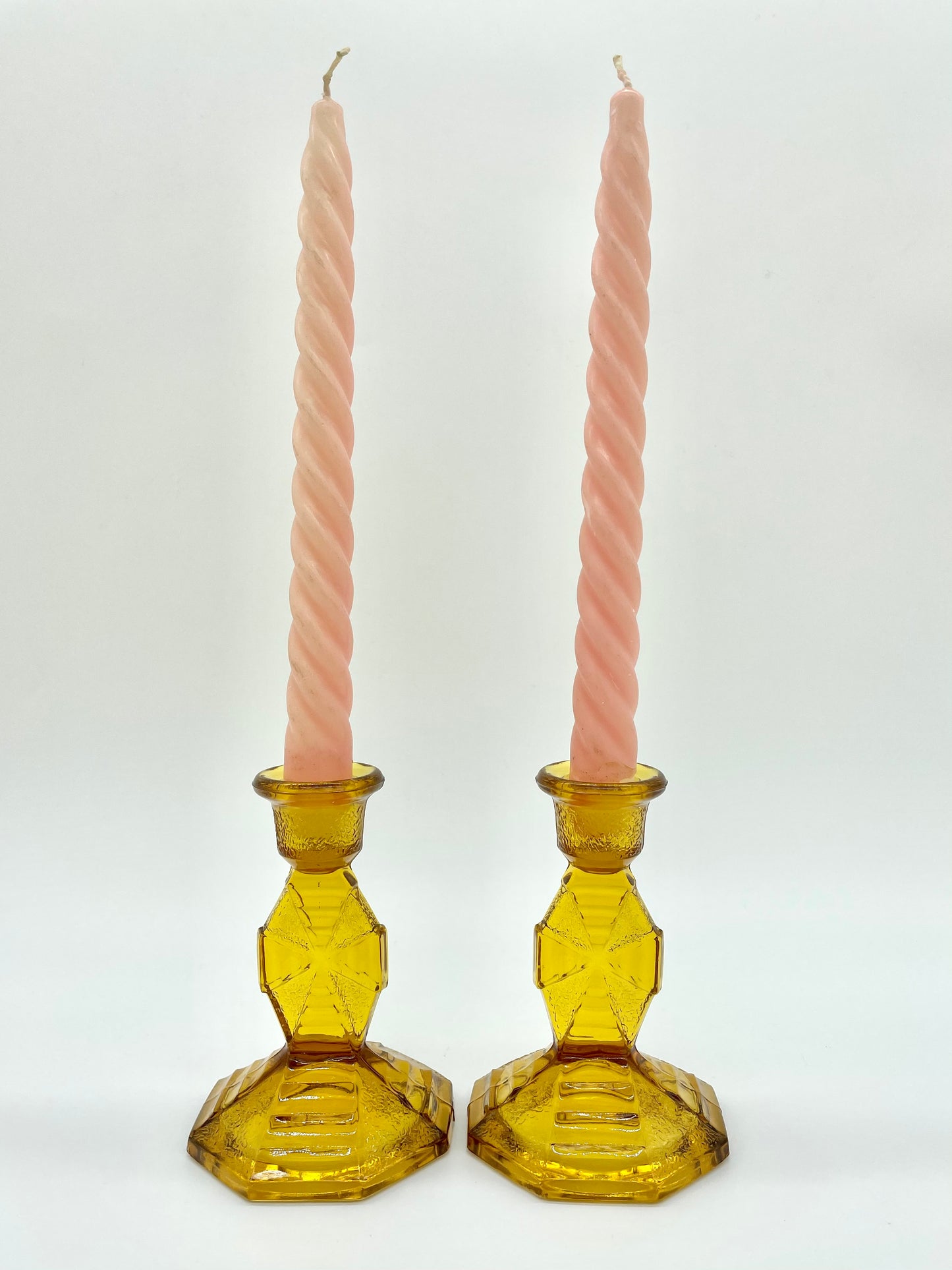 Pair of amber glass candlestick holders