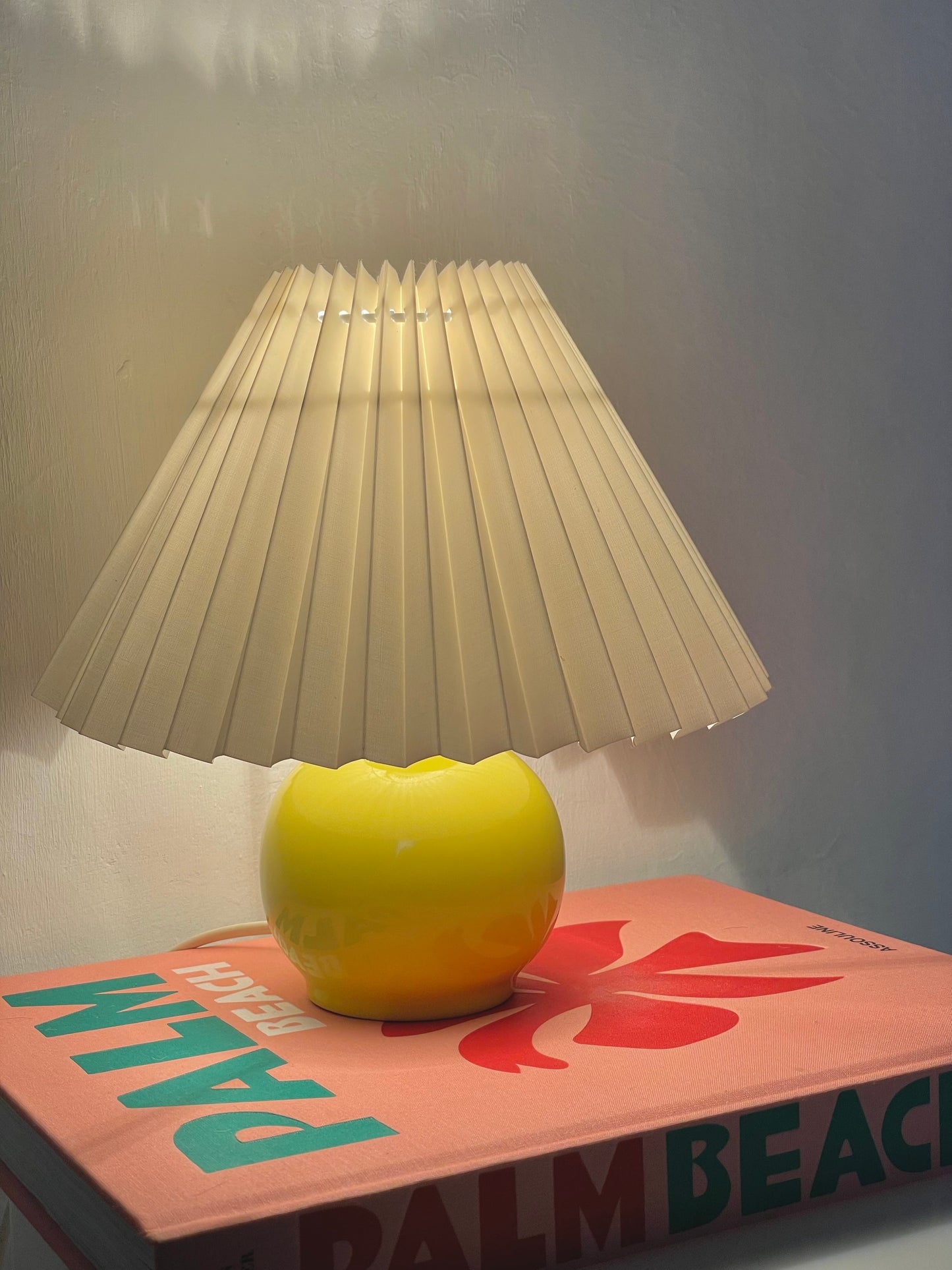 Yellow ball lamp with pleated shade