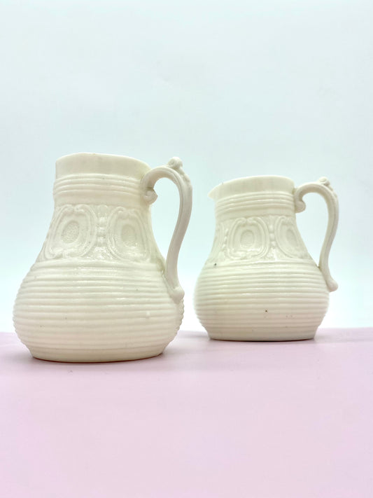 Pair of Ivory coloured Parian ware jugs