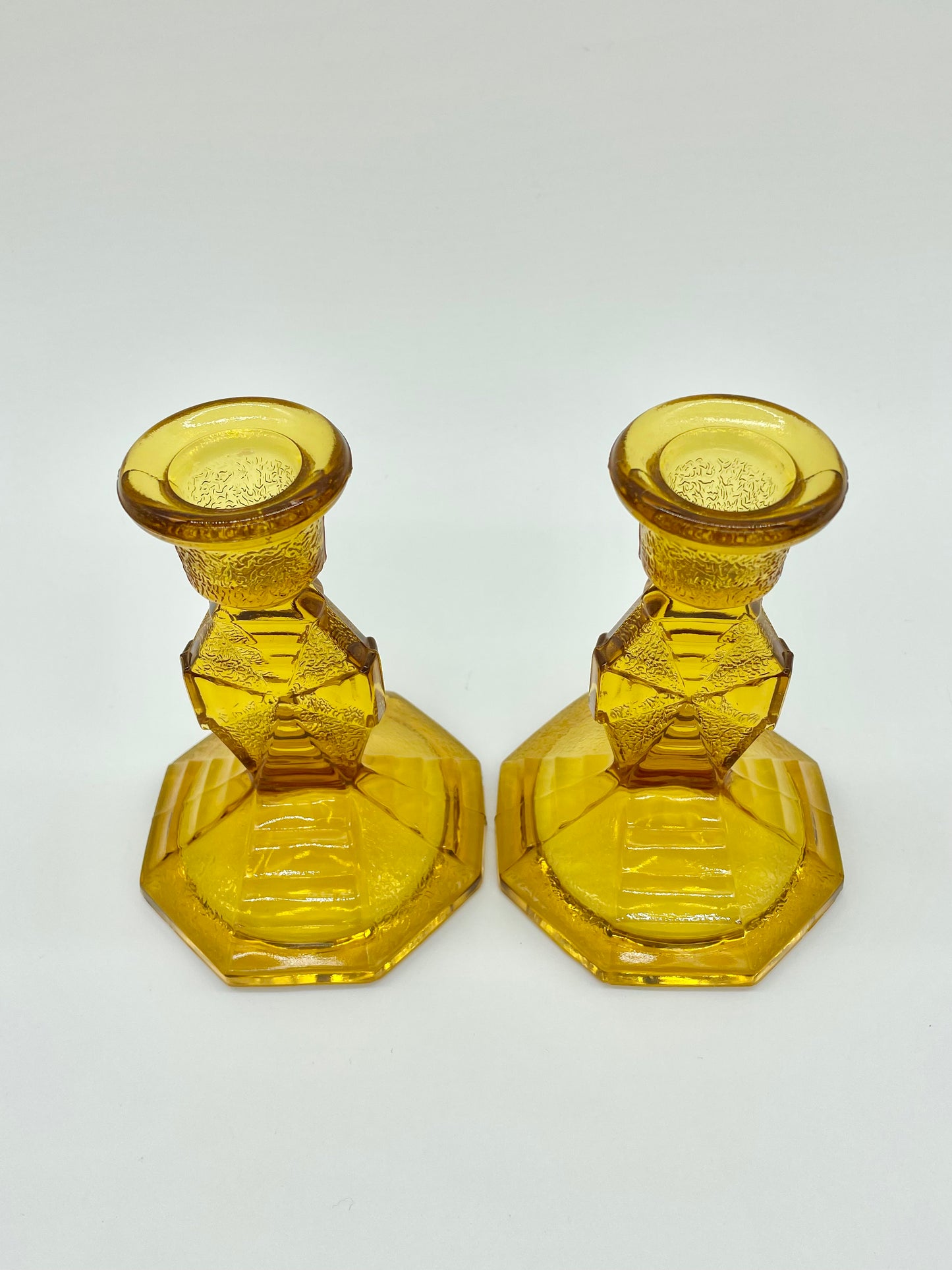 Pair of amber glass candlestick holders