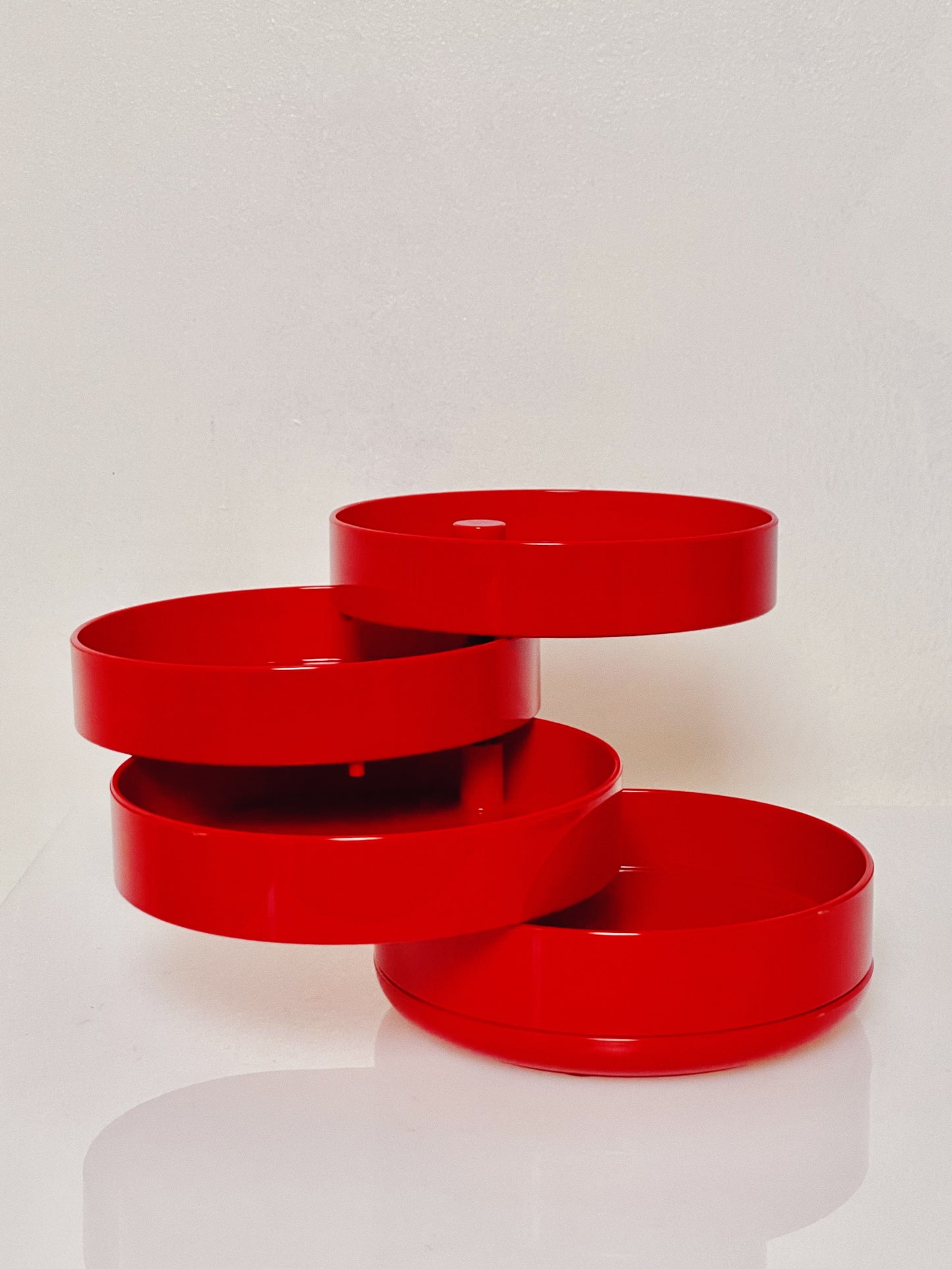 Red swivel desk tidy