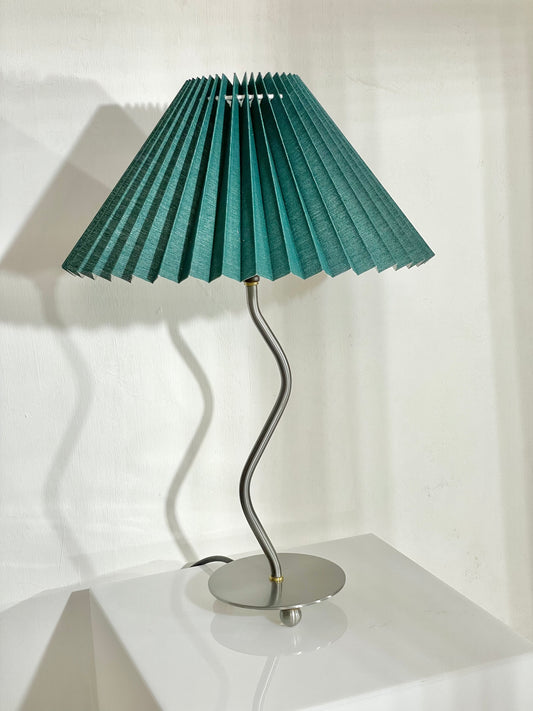 Wiggle lamp with green pleated shade